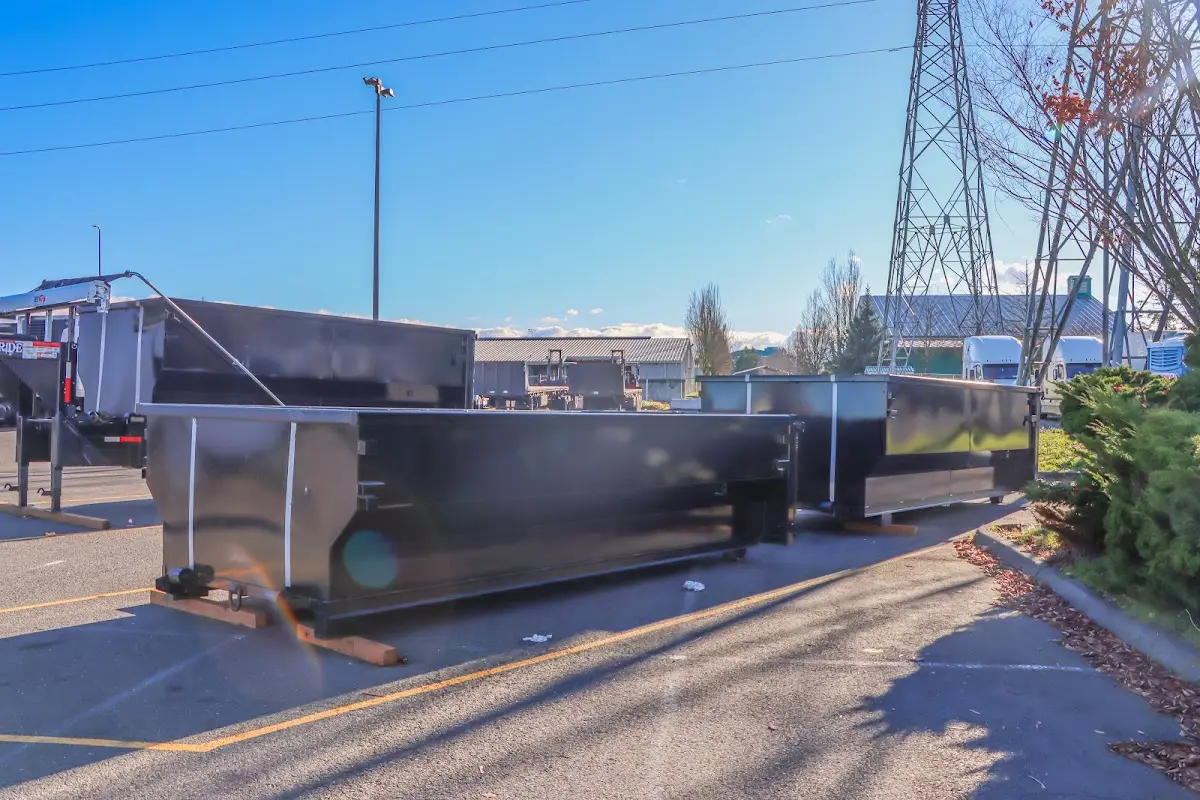 Roll-off dumpster ready for waste disposal at job site for Commercial Dumpster Rental in Bedford
